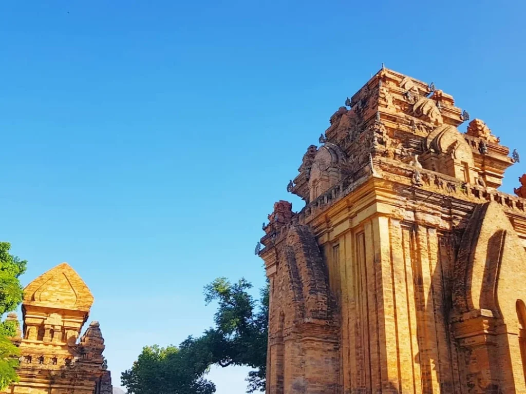 Cruising with Danny and Peter, Holland America Line, Westerdam, Nha Trang, Vietnam | Vibrant local markets in Nha Trang showcasing fresh produce and street food during a Nha Trang tour experience; scenic river cruise views with lush landscapes; delicious Vietnamese dishes like pho and banh mi from a Nha Trang food tour; historical sites featuring ancient temples and architecture in Nha Trang, Vietnam.