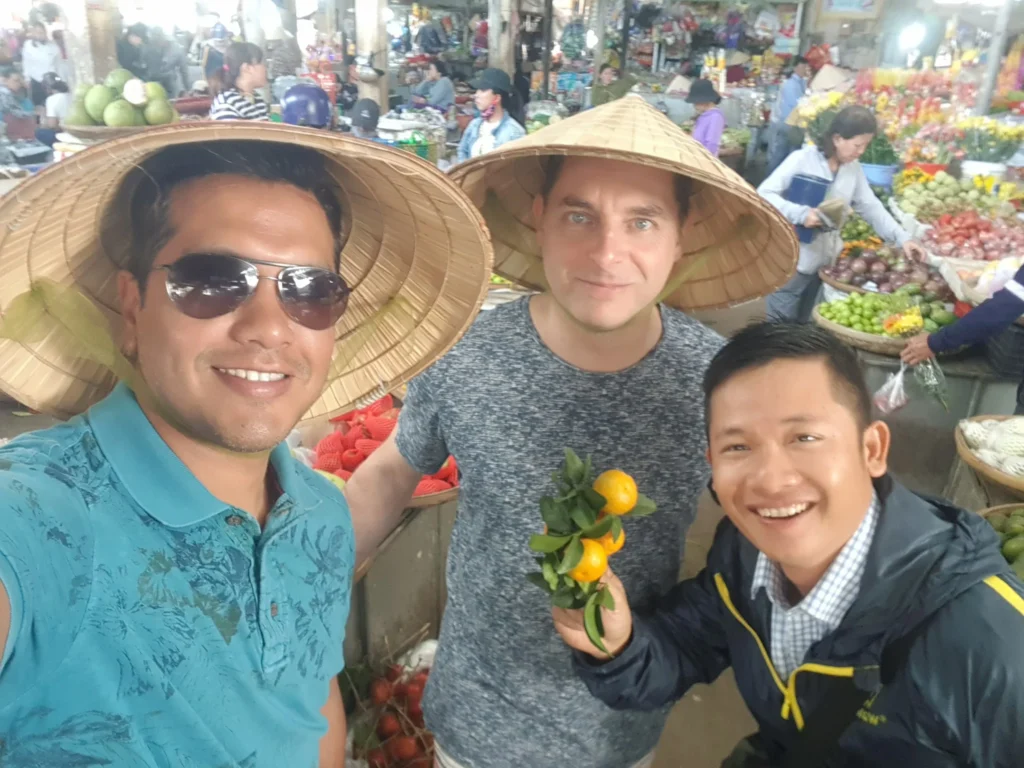 Cruising with Danny and Peter, Holland America Line, Westerdam, Nha Trang, Vietnam | Vibrant local markets in Nha Trang showcasing fresh produce and street food during a Nha Trang tour experience; scenic river cruise views with lush landscapes; delicious Vietnamese dishes like pho and banh mi from a Nha Trang food tour; historical sites featuring ancient temples and architecture in Nha Trang, Vietnam.