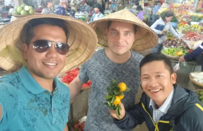 Cruising with Danny and Peter, Holland America Line, Westerdam, Nha Trang, Vietnam | Vibrant local markets in Nha Trang showcasing fresh produce and street food during a Nha Trang tour experience; scenic river cruise views with lush landscapes; delicious Vietnamese dishes like pho and banh mi from a Nha Trang food tour; historical sites featuring ancient temples and architecture in Nha Trang, Vietnam.