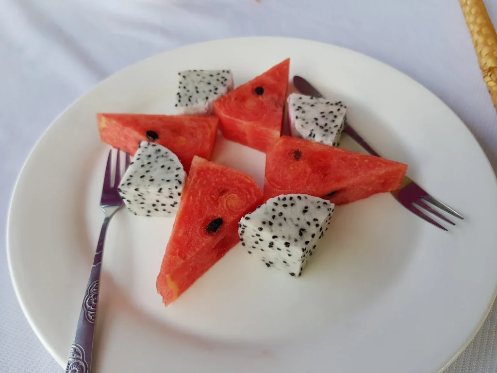 Cruising with Danny and Peter, Holland America Line, Westerdam, Nha Trang, Vietnam | Vibrant local markets in Nha Trang showcasing fresh produce and street food during a Nha Trang tour experience; scenic river cruise views with lush landscapes; delicious Vietnamese dishes like pho and banh mi from a Nha Trang food tour; historical sites featuring ancient temples and architecture in Nha Trang, Vietnam.