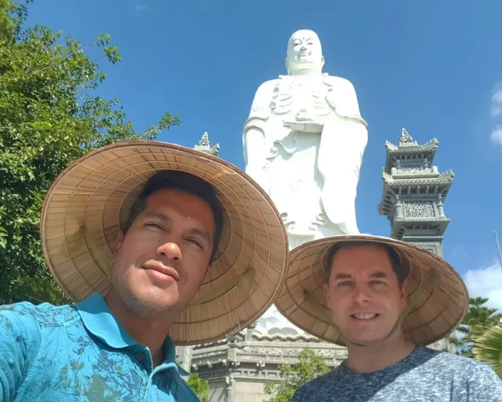 Cruising with Danny and Peter, Holland America Line, Westerdam, Nha Trang, Vietnam | Vibrant local markets in Nha Trang showcasing fresh produce and street food during a Nha Trang tour experience; scenic river cruise views with lush landscapes; delicious Vietnamese dishes like pho and banh mi from a Nha Trang food tour; historical sites featuring ancient temples and architecture in Nha Trang, Vietnam.