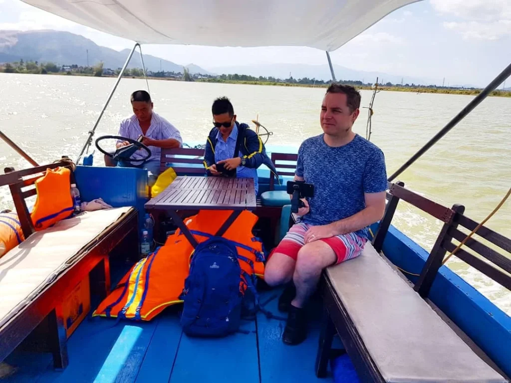 Cruising with Danny and Peter, Holland America Line, Westerdam, Nha Trang, Vietnam | Vibrant local markets in Nha Trang showcasing fresh produce and street food during a Nha Trang tour experience; scenic river cruise views with lush landscapes; delicious Vietnamese dishes like pho and banh mi from a Nha Trang food tour; historical sites featuring ancient temples and architecture in Nha Trang, Vietnam.