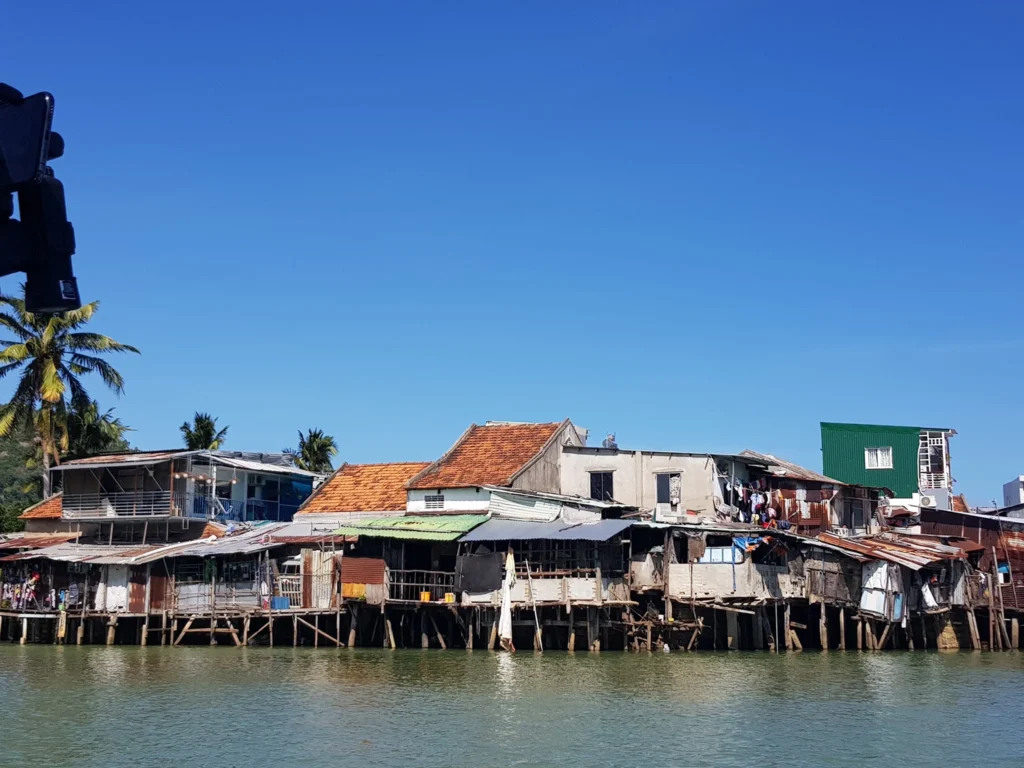 Cruising with Danny and Peter, Holland America Line, Westerdam, Nha Trang, Vietnam | Vibrant local markets in Nha Trang showcasing fresh produce and street food during a Nha Trang tour experience; scenic river cruise views with lush landscapes; delicious Vietnamese dishes like pho and banh mi from a Nha Trang food tour; historical sites featuring ancient temples and architecture in Nha Trang, Vietnam.