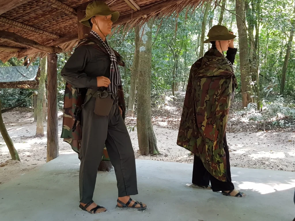 Cruising with Danny and Peter, Holland America Line, Westerdam, Phu My, Vietnam | Visitors exploring the Cu Chi Tunnels, a historic underground network used during the Vietnam War near Ho Chi Minh City, showcasing the Viet Cong's guerrilla tactics and the resilience of the Vietnamese people. The intricate tunnels of Cu Chi, complete with living quarters, are an iconic part of Vietnam's cultural heritage and historical sites, providing insight into underground warfare and the country's wartime history.