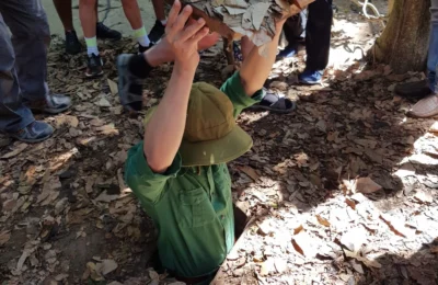 Cruising with Danny and Peter, Holland America Line, Westerdam, Phu My, Vietnam | Visitors exploring the Cu Chi Tunnels, a historic underground network used during the Vietnam War near Ho Chi Minh City, showcasing the Viet Cong's guerrilla tactics and the resilience of the Vietnamese people. The intricate tunnels of Cu Chi, complete with living quarters, are an iconic part of Vietnam's cultural heritage and historical sites, providing insight into underground warfare and the country's wartime history.