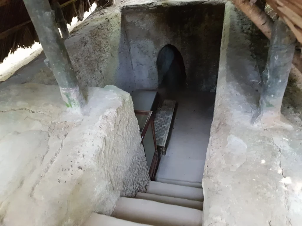 Cruising with Danny and Peter, Holland America Line, Westerdam, Phu My, Vietnam | Visitors exploring the Cu Chi Tunnels, a historic underground network used during the Vietnam War near Ho Chi Minh City, showcasing the Viet Cong's guerrilla tactics and the resilience of the Vietnamese people. The intricate tunnels of Cu Chi, complete with living quarters, are an iconic part of Vietnam's cultural heritage and historical sites, providing insight into underground warfare and the country's wartime history.