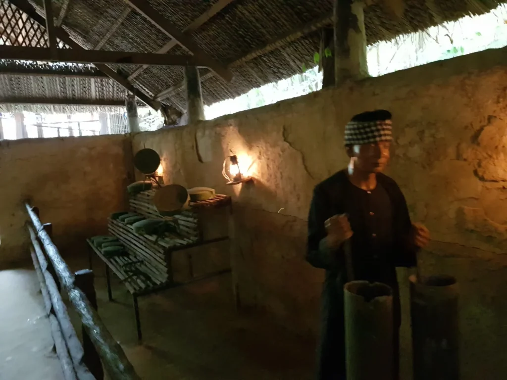 Cruising with Danny and Peter, Holland America Line, Westerdam, Phu My, Vietnam | Visitors exploring the Cu Chi Tunnels, a historic underground network used during the Vietnam War near Ho Chi Minh City, showcasing the Viet Cong's guerrilla tactics and the resilience of the Vietnamese people. The intricate tunnels of Cu Chi, complete with living quarters, are an iconic part of Vietnam's cultural heritage and historical sites, providing insight into underground warfare and the country's wartime history.