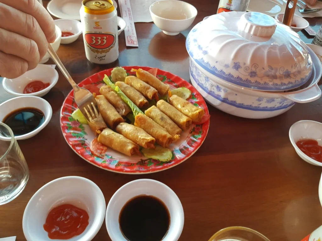 Cruising with Danny and Peter, Holland America Line, Westerdam, Phu My, Vietnam | Visitors exploring the Cu Chi Tunnels, a historic underground network used during the Vietnam War near Ho Chi Minh City, showcasing the Viet Cong's guerrilla tactics and the resilience of the Vietnamese people. The intricate tunnels of Cu Chi, complete with living quarters, are an iconic part of Vietnam's cultural heritage and historical sites, providing insight into underground warfare and the country's wartime history.