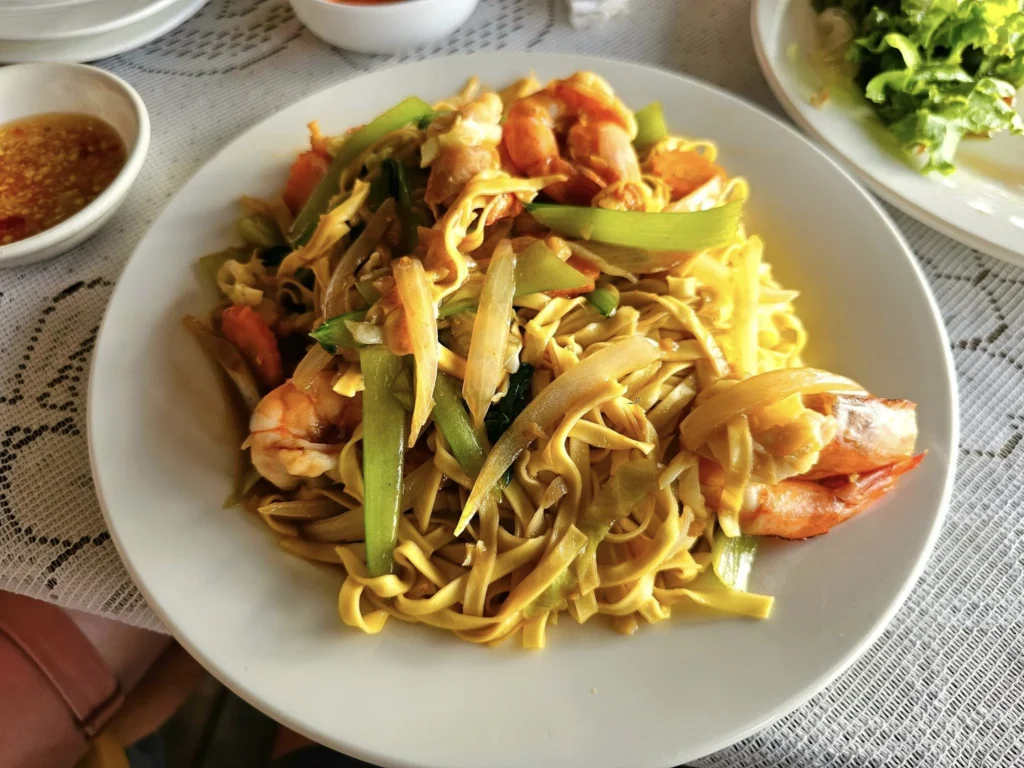 Cruising with Danny and Peter, Holland America Line, Westerdam, Sihanoukville, Cambodia, Cambodia Coastal Exploration | Golden sands and turquoise waves at Sihanoukville Beaches, busy Le Kep Crab Market with fresh crab and Kampot pepper, lush green vines at Kampot Pepper Farms, elegant French Colonial Architecture along Kampot riverside, and grilled fish with Kampot pepper at Fresh Seafood Cambodia stall—all captured during an unforgettable Cambodia Coastal Exploration and Cambodia Coastal Cultural Adventure with Holland America Westerdam in Cambodia’s coastal towns.