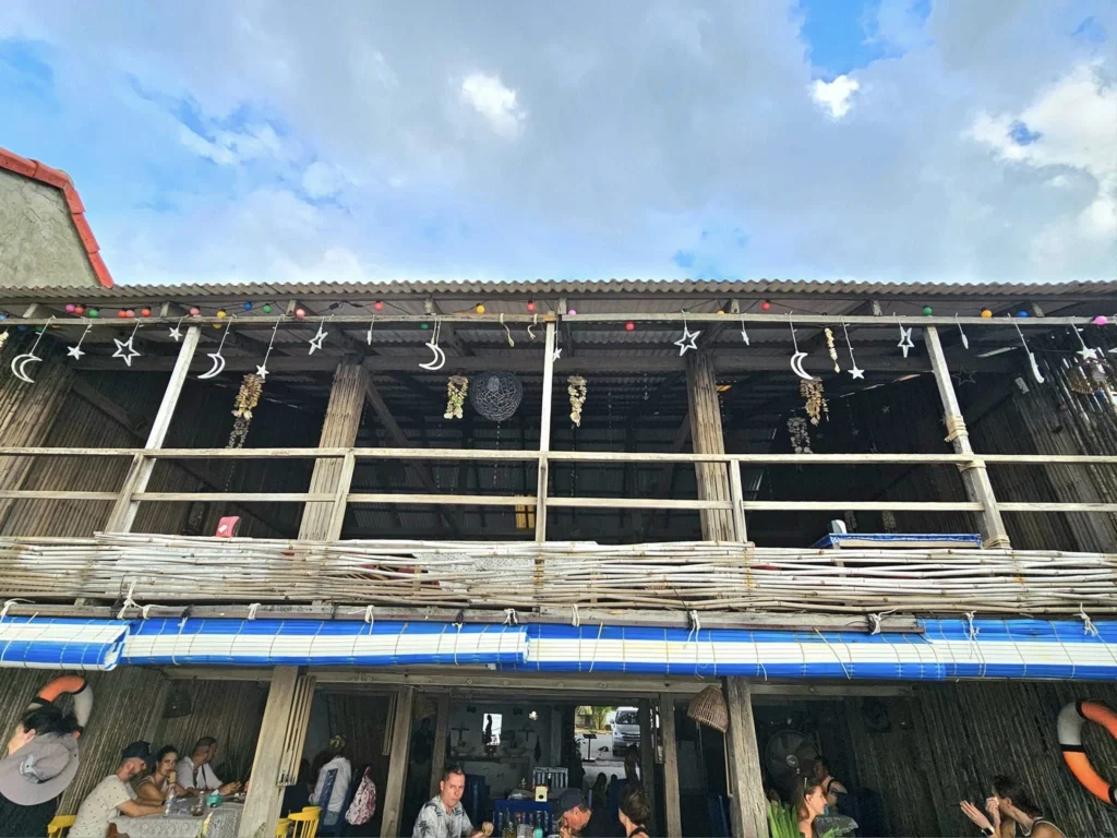 Cruising with Danny and Peter, Holland America Line, Westerdam, Sihanoukville, Cambodia, Cambodia Coastal Exploration | Golden sands and turquoise waves at Sihanoukville Beaches, busy Le Kep Crab Market with fresh crab and Kampot pepper, lush green vines at Kampot Pepper Farms, elegant French Colonial Architecture along Kampot riverside, and grilled fish with Kampot pepper at Fresh Seafood Cambodia stall—all captured during an unforgettable Cambodia Coastal Exploration and Cambodia Coastal Cultural Adventure with Holland America Westerdam in Cambodia’s coastal towns.