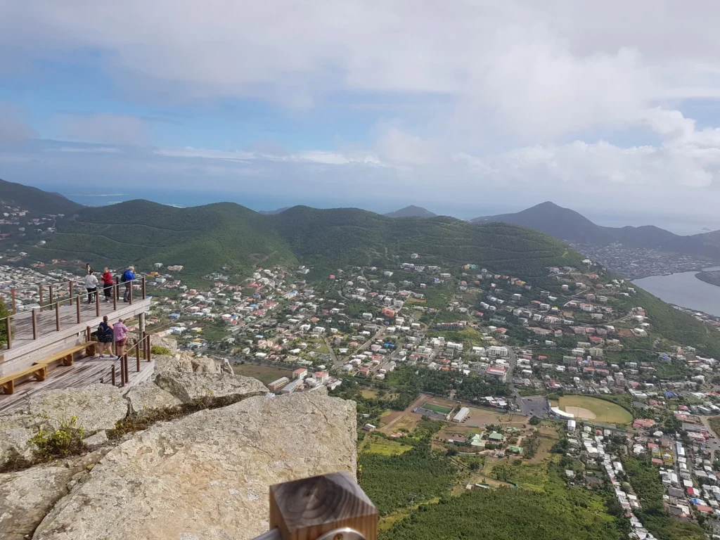 Cruising with Danny and Peter, Holland America Line, Zuiderdam, Philipsburg, Sint-Maarten | Adventurers soaring through the sky on the Philipsburg zip-line, enjoying breathtaking scenic views of lush Caribbean landscapes, turquoise waters, and the charming architecture of Philipsburg during an exhilarating aerial adventure.