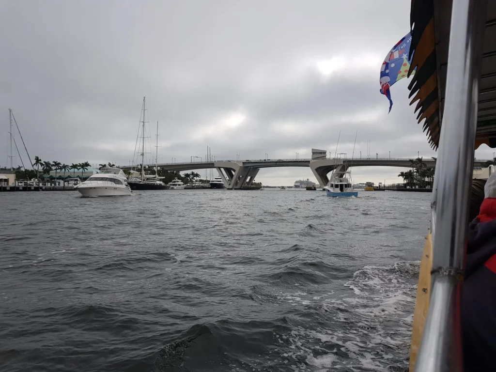 Cruising with Danny and Peter, Holland America Line, Nieuw Amsterdam, Fort Lauderdale, Florida, United States | A scenic view of a Fort Lauderdale river cruise adventure showcasing lush palm trees lining the waterways, luxury mansions along Millionaire's Row, and vibrant sunset reflections on the water, capturing the essence of a memorable canal cruise in Fort Lauderdale.
