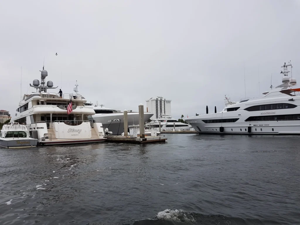 Cruising with Danny and Peter, Holland America Line, Nieuw Amsterdam, Fort Lauderdale, Florida, United States | A scenic view of a Fort Lauderdale river cruise adventure showcasing lush palm trees lining the waterways, luxury mansions along Millionaire's Row, and vibrant sunset reflections on the water, capturing the essence of a memorable canal cruise in Fort Lauderdale.