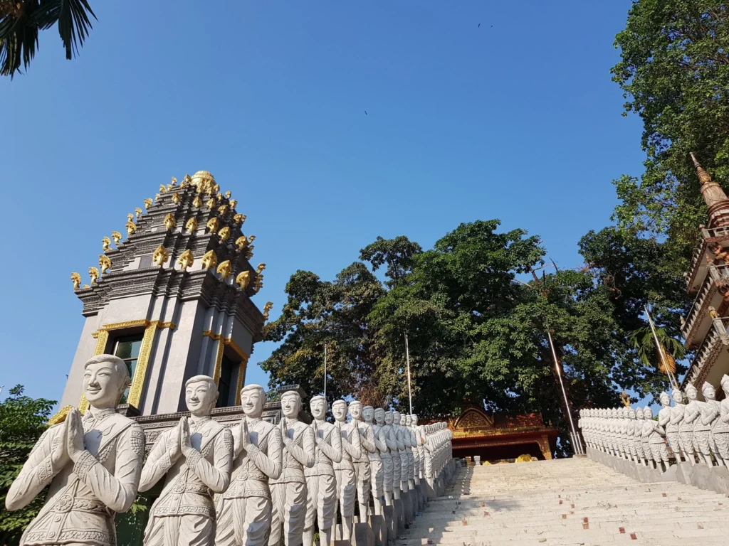 Cruising with Danny and Peter, Holland America Line, Westerdam, Sihanoukville, Cambodia | Pagoda visit in Sihanoukville during a cultural experience, featuring a monk blessing ceremony, vibrant local market tour, and serene beach retreat for a memorable spiritual and cultural day trip in Cambodia.