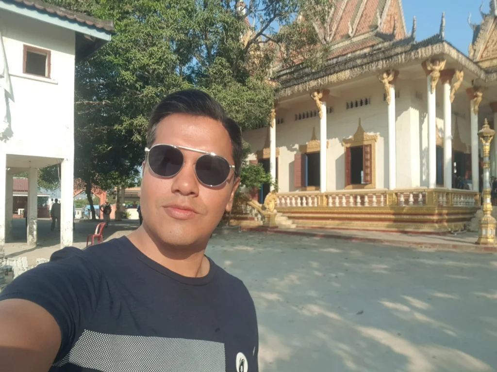 Cruising with Danny and Peter, Holland America Line, Westerdam, Sihanoukville, Cambodia | Pagoda visit in Sihanoukville during a cultural experience, featuring a monk blessing ceremony, vibrant local market tour, and serene beach retreat for a memorable spiritual and cultural day trip in Cambodia.