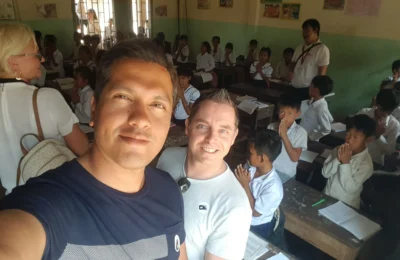 Cruising with Danny and Peter, Holland America Line, Westerdam, Sihanoukville, Cambodia | Pagoda visit in Sihanoukville during a cultural experience, featuring a monk blessing ceremony, vibrant local market tour, and serene beach retreat for a memorable spiritual and cultural day trip in Cambodia.