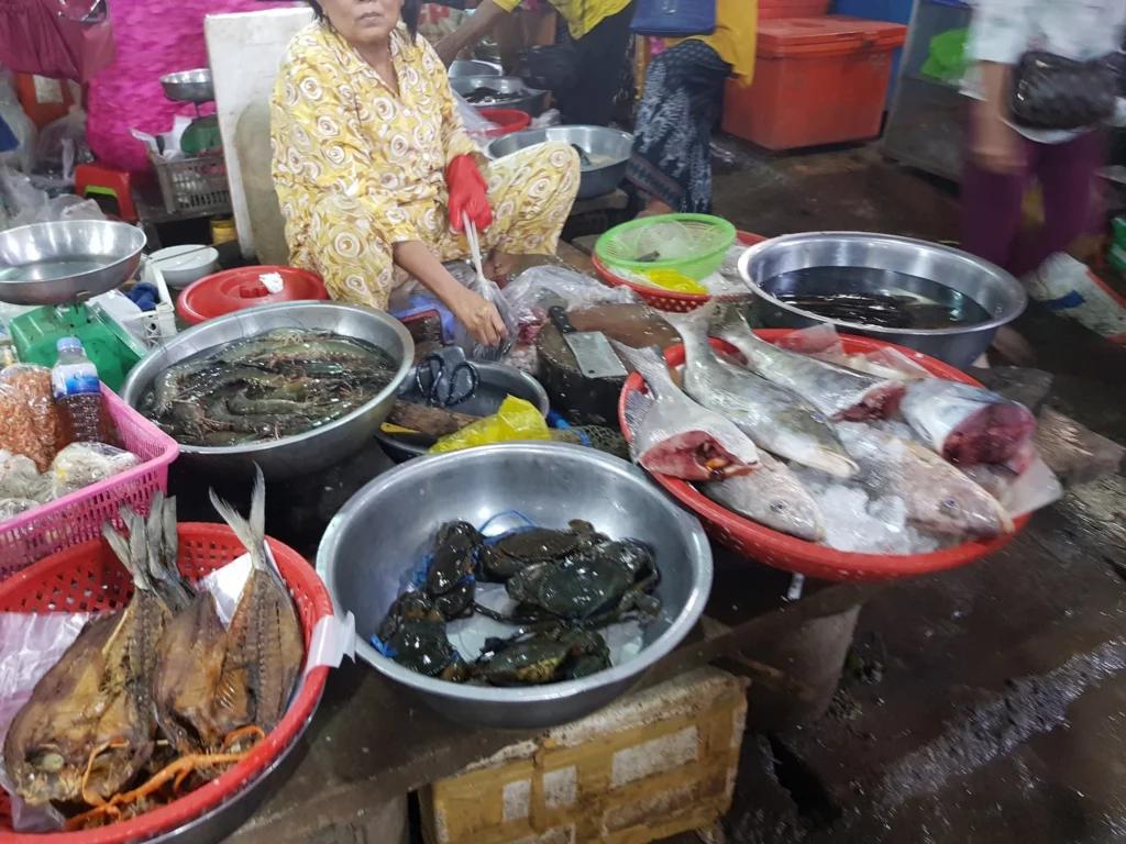 Cruising with Danny and Peter, Holland America Line, Westerdam, Sihanoukville, Cambodia | Pagoda visit in Sihanoukville during a cultural experience, featuring a monk blessing ceremony, vibrant local market tour, and serene beach retreat for a memorable spiritual and cultural day trip in Cambodia.