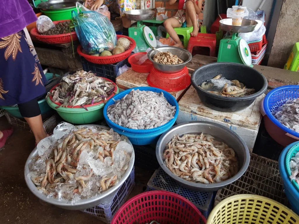 Cruising with Danny and Peter, Holland America Line, Westerdam, Sihanoukville, Cambodia | Pagoda visit in Sihanoukville during a cultural experience, featuring a monk blessing ceremony, vibrant local market tour, and serene beach retreat for a memorable spiritual and cultural day trip in Cambodia.