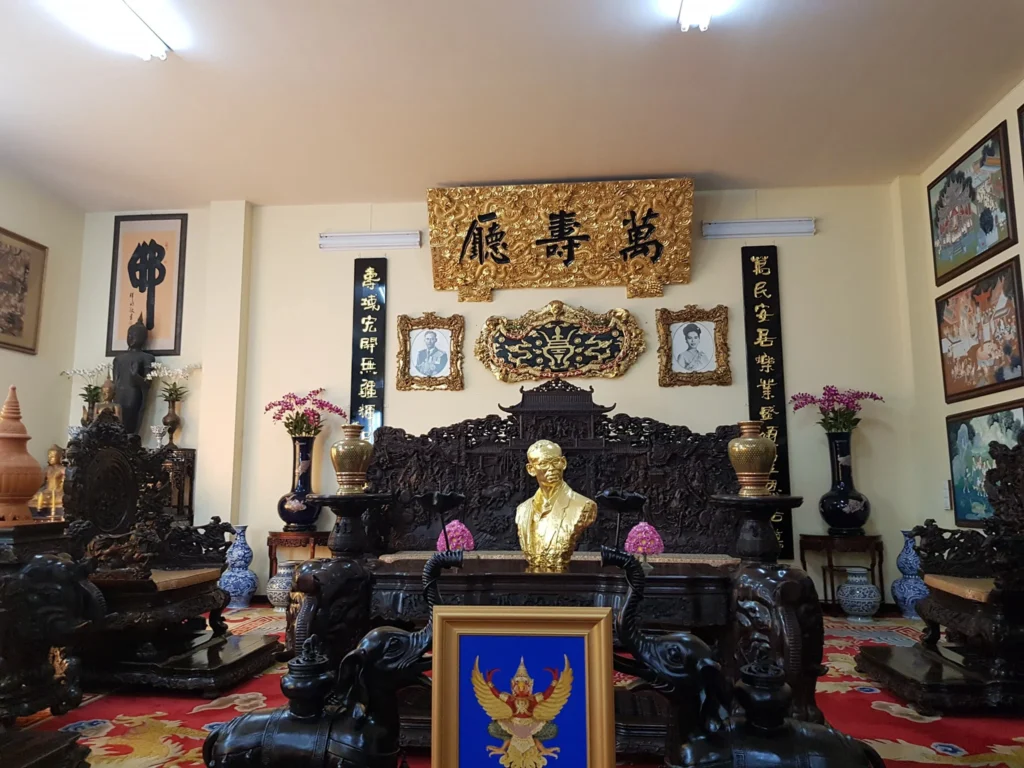 Cruising with Danny and Peter, Holland America Line, Westerdam, Laem Chabang, Bangkok, Thailand | A serene view of Wat Yan Nasangwararam temple in Pattaya, showcasing intricate Thai architecture surrounded by lush greenery. In the foreground, worshippers engage in meditation and tranquility, while the majestic Khao Chi Chan Buddha monument looms in the background, radiating serenity. This scene captures the essence of a spiritual journey in Pattaya, highlighting the cultural heritage of Thai Buddhism and the beauty of religious art in Thailand.