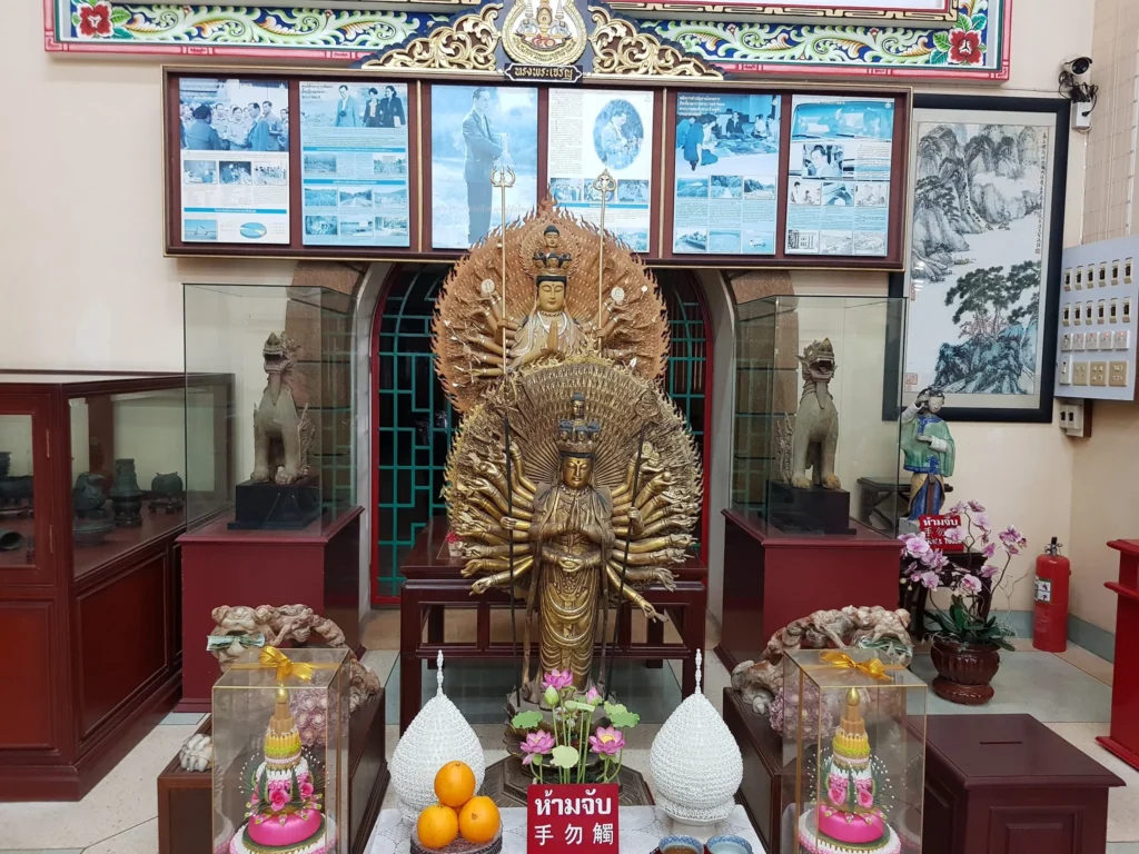 Cruising with Danny and Peter, Holland America Line, Westerdam, Laem Chabang, Bangkok, Thailand | A serene view of Wat Yan Nasangwararam temple in Pattaya, showcasing intricate Thai architecture surrounded by lush greenery. In the foreground, worshippers engage in meditation and tranquility, while the majestic Khao Chi Chan Buddha monument looms in the background, radiating serenity. This scene captures the essence of a spiritual journey in Pattaya, highlighting the cultural heritage of Thai Buddhism and the beauty of religious art in Thailand.