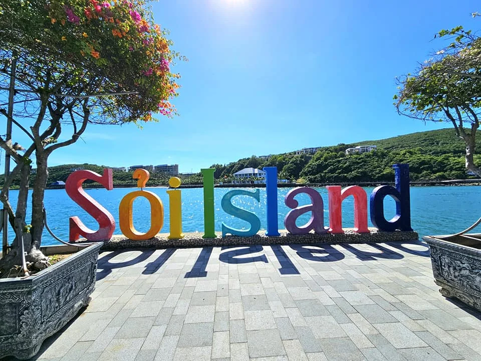 Cruising with Danny and Peter, Holland America Line, Westerdam, Nha Trang, Vietnam, Nha Trang Island Escapade Adventure | Group of tourists enjoying a Nha Trang Island Escapade Adventure featuring Mieu Island Exploration under a tropical sun, vibrant underwater scenes from Coral Reef Snorkeling in Nha Trang Bay, the pirate ship-shaped Tri Nguyen Aquarium showcasing a Marine Life Experience on a Vietnam Coastal Adventure, local fishermen feeding groupers during a Fishing Village Visit, relaxing on golden sands at Mini Beach Relaxation after a Nha Trang Island Tour with Holland America Cruise, and a scenic view of Nha Trang Bay from a boat during a Tropical Island Retreat.