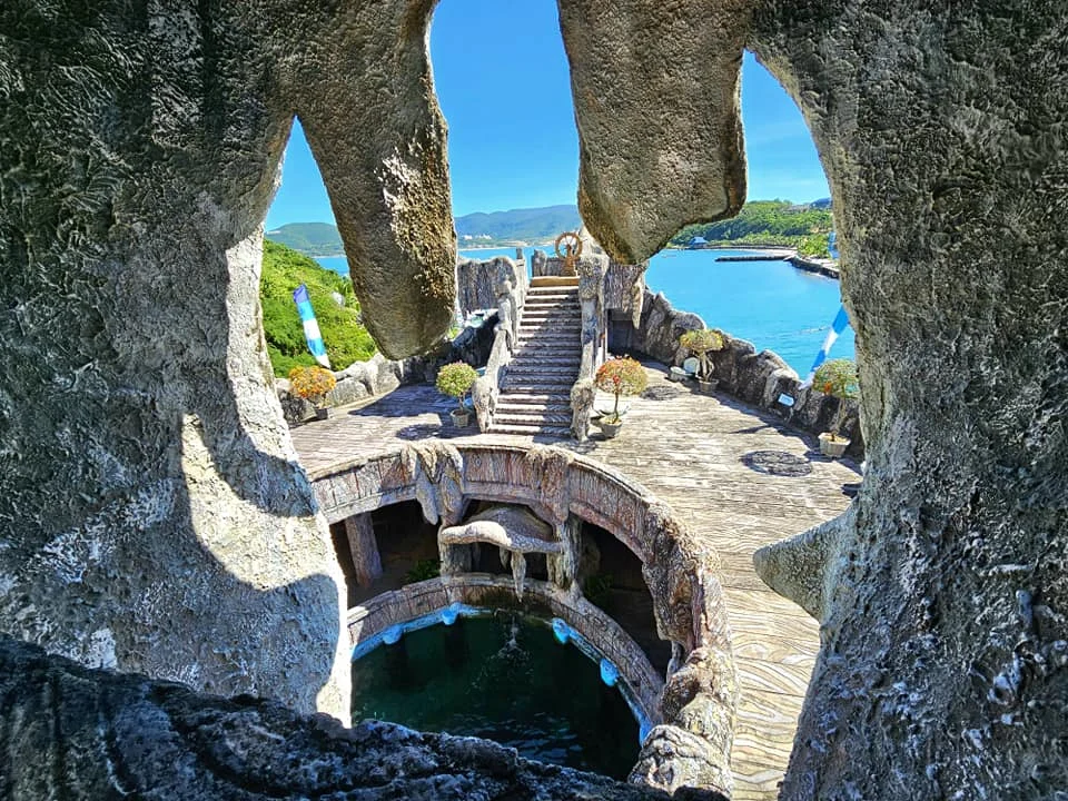Cruising with Danny and Peter, Holland America Line, Westerdam, Nha Trang, Vietnam, Nha Trang Island Escapade Adventure | Group of tourists enjoying a Nha Trang Island Escapade Adventure featuring Mieu Island Exploration under a tropical sun, vibrant underwater scenes from Coral Reef Snorkeling in Nha Trang Bay, the pirate ship-shaped Tri Nguyen Aquarium showcasing a Marine Life Experience on a Vietnam Coastal Adventure, local fishermen feeding groupers during a Fishing Village Visit, relaxing on golden sands at Mini Beach Relaxation after a Nha Trang Island Tour with Holland America Cruise, and a scenic view of Nha Trang Bay from a boat during a Tropical Island Retreat.