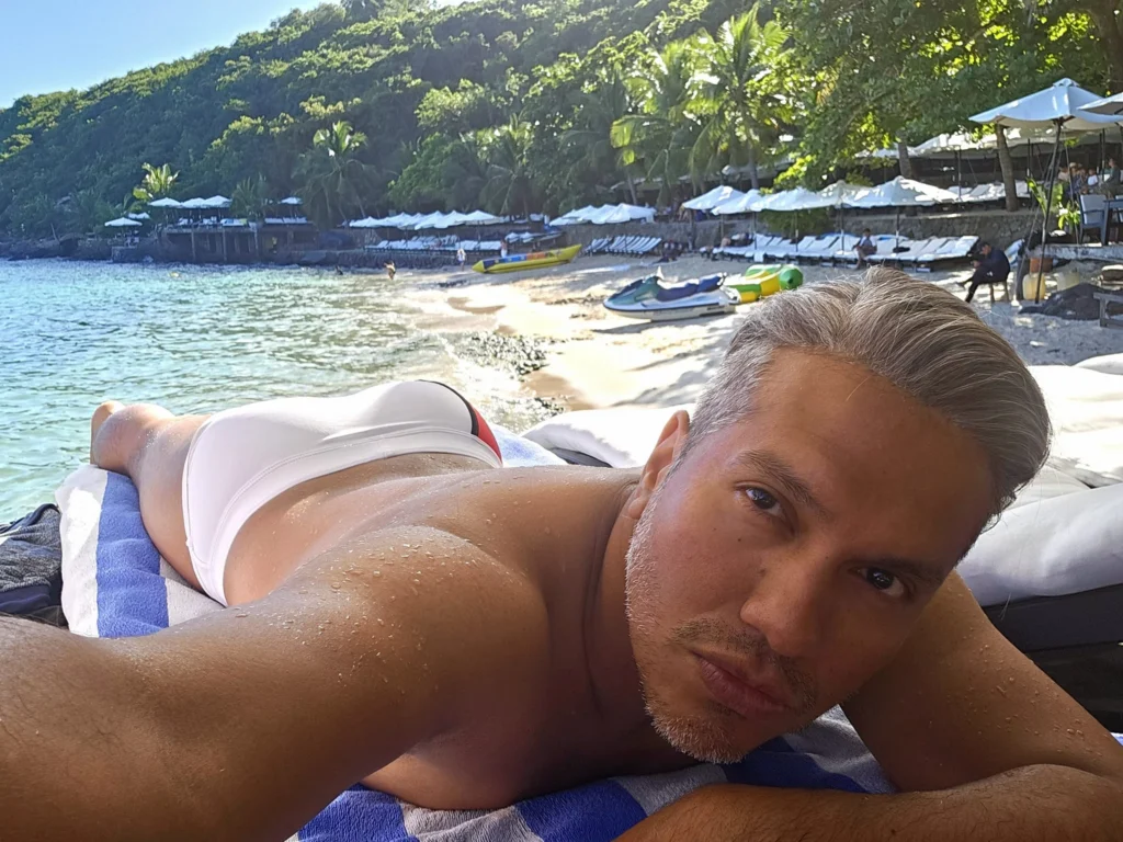 Cruising with Danny and Peter, Holland America Line, Westerdam, Nha Trang, Vietnam, Nha Trang Island Escapade Adventure | Group of tourists enjoying a Nha Trang Island Escapade Adventure featuring Mieu Island Exploration under a tropical sun, vibrant underwater scenes from Coral Reef Snorkeling in Nha Trang Bay, the pirate ship-shaped Tri Nguyen Aquarium showcasing a Marine Life Experience on a Vietnam Coastal Adventure, local fishermen feeding groupers during a Fishing Village Visit, relaxing on golden sands at Mini Beach Relaxation after a Nha Trang Island Tour with Holland America Cruise, and a scenic view of Nha Trang Bay from a boat during a Tropical Island Retreat.