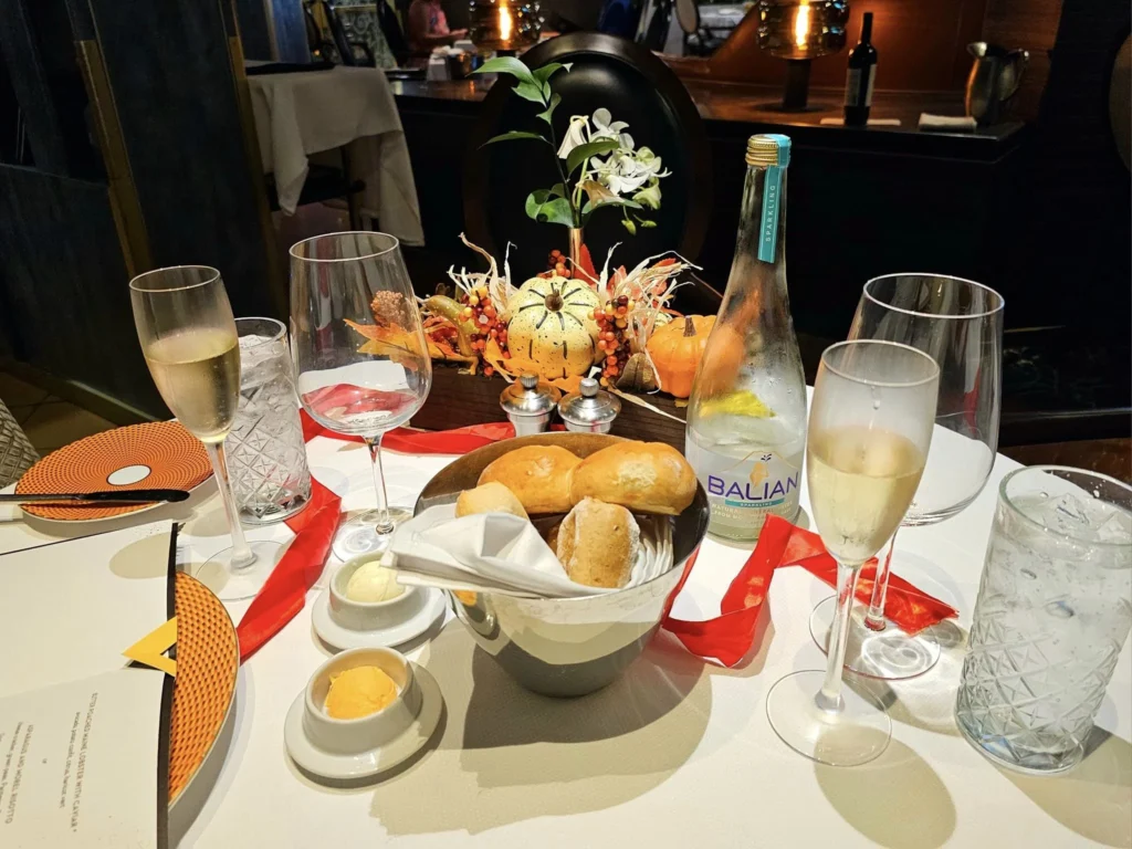 Cruising with Danny and Peter, Holland America Line, Westerdam, Nha Trang, Vietnam, Nha Trang Island Escapade Adventure | Group of tourists enjoying a Nha Trang Island Escapade Adventure featuring Mieu Island Exploration under a tropical sun, vibrant underwater scenes from Coral Reef Snorkeling in Nha Trang Bay, the pirate ship-shaped Tri Nguyen Aquarium showcasing a Marine Life Experience on a Vietnam Coastal Adventure, local fishermen feeding groupers during a Fishing Village Visit, relaxing on golden sands at Mini Beach Relaxation after a Nha Trang Island Tour with Holland America Cruise, and a scenic view of Nha Trang Bay from a boat during a Tropical Island Retreat.