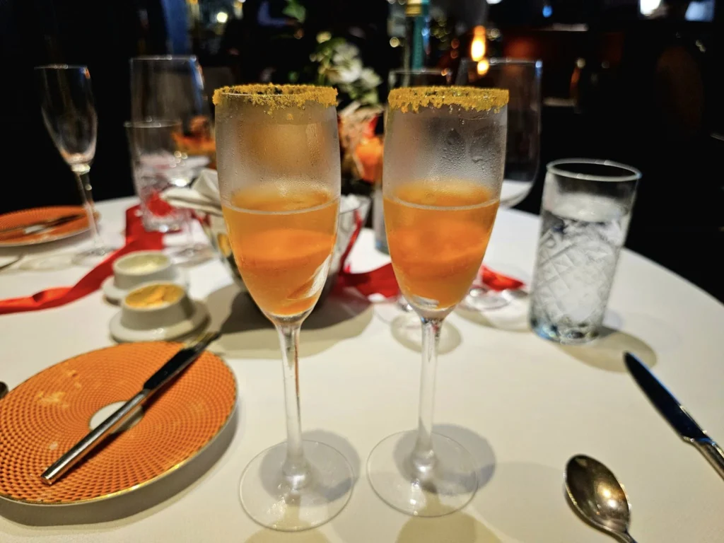 Cruising with Danny and Peter, Holland America Line, Westerdam, Nha Trang, Vietnam, Nha Trang Island Escapade Adventure | Group of tourists enjoying a Nha Trang Island Escapade Adventure featuring Mieu Island Exploration under a tropical sun, vibrant underwater scenes from Coral Reef Snorkeling in Nha Trang Bay, the pirate ship-shaped Tri Nguyen Aquarium showcasing a Marine Life Experience on a Vietnam Coastal Adventure, local fishermen feeding groupers during a Fishing Village Visit, relaxing on golden sands at Mini Beach Relaxation after a Nha Trang Island Tour with Holland America Cruise, and a scenic view of Nha Trang Bay from a boat during a Tropical Island Retreat.