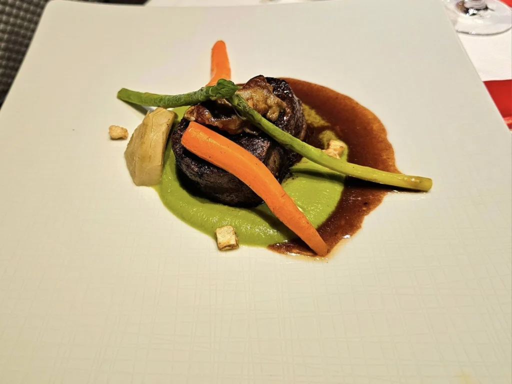 Cruising with Danny and Peter, Holland America Line, Westerdam, Nha Trang, Vietnam, Nha Trang Island Escapade Adventure | Group of tourists enjoying a Nha Trang Island Escapade Adventure featuring Mieu Island Exploration under a tropical sun, vibrant underwater scenes from Coral Reef Snorkeling in Nha Trang Bay, the pirate ship-shaped Tri Nguyen Aquarium showcasing a Marine Life Experience on a Vietnam Coastal Adventure, local fishermen feeding groupers during a Fishing Village Visit, relaxing on golden sands at Mini Beach Relaxation after a Nha Trang Island Tour with Holland America Cruise, and a scenic view of Nha Trang Bay from a boat during a Tropical Island Retreat.