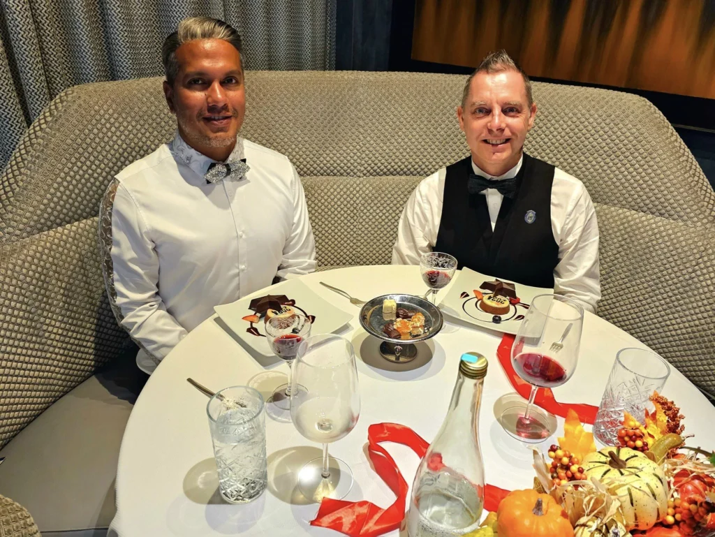 Cruising with Danny and Peter, Holland America Line, Westerdam, Nha Trang, Vietnam, Nha Trang Island Escapade Adventure | Group of tourists enjoying a Nha Trang Island Escapade Adventure featuring Mieu Island Exploration under a tropical sun, vibrant underwater scenes from Coral Reef Snorkeling in Nha Trang Bay, the pirate ship-shaped Tri Nguyen Aquarium showcasing a Marine Life Experience on a Vietnam Coastal Adventure, local fishermen feeding groupers during a Fishing Village Visit, relaxing on golden sands at Mini Beach Relaxation after a Nha Trang Island Tour with Holland America Cruise, and a scenic view of Nha Trang Bay from a boat during a Tropical Island Retreat.