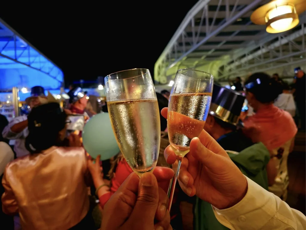 Cruising with Danny and Peter, Holland America Line, Westerdam, Nha Trang, Vietnam, Nha Trang Island Escapade Adventure | Group of tourists enjoying a Nha Trang Island Escapade Adventure featuring Mieu Island Exploration under a tropical sun, vibrant underwater scenes from Coral Reef Snorkeling in Nha Trang Bay, the pirate ship-shaped Tri Nguyen Aquarium showcasing a Marine Life Experience on a Vietnam Coastal Adventure, local fishermen feeding groupers during a Fishing Village Visit, relaxing on golden sands at Mini Beach Relaxation after a Nha Trang Island Tour with Holland America Cruise, and a scenic view of Nha Trang Bay from a boat during a Tropical Island Retreat.