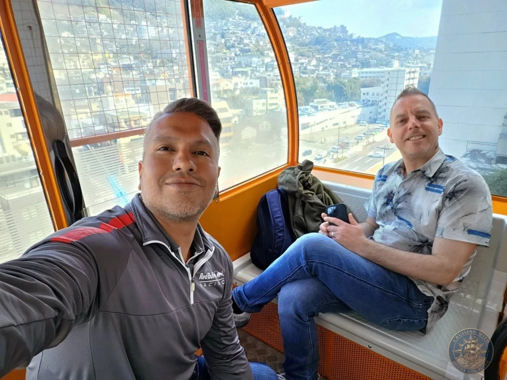 Selfie inside the Nagasaki Ferris wheel gondola with Danny and Peter enjoying panoramic views over the city, a highlight in Nagasaki Japan cruise port guide. Perfect for things to do in Nagasaki from cruise ship and one day in Nagasaki Japan itinerary when exploring Mirai Nagasaki Coco Walk from the Westerdam by Danny and Peter.
