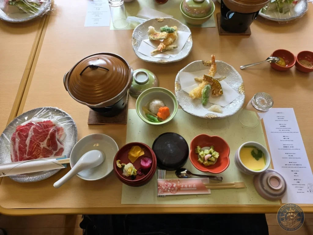 Delicious Kagoshima black pork (Kurobuta) shabu-shabu lunch set with hot pot, fresh sliced pork, tempura, and side dishes at Nakahara Bessou restaurant. Perfect dining experience during a shore excursion in Kagoshima, Japan. Kagoshima Cruise Port Guide | Things to do in Kagoshima from cruise ship | One day in Kagoshima Japan itinerary by Danny and Peter.