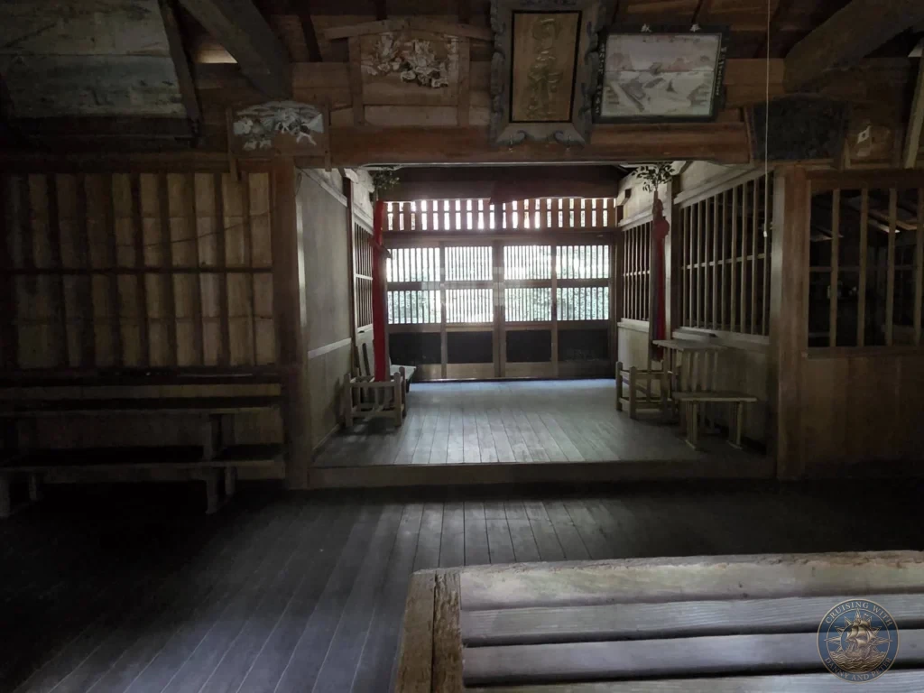 Traditional wooden interior of a hall at Chikurin Temple in Kochi, Japan. Rustic timber architecture, benches, and open sliding doors with natural light. Kochi Cruise Port Guide | Things to do in Kochi from cruise ship | One day in Kochi Japan itinerary by Danny and Peter.