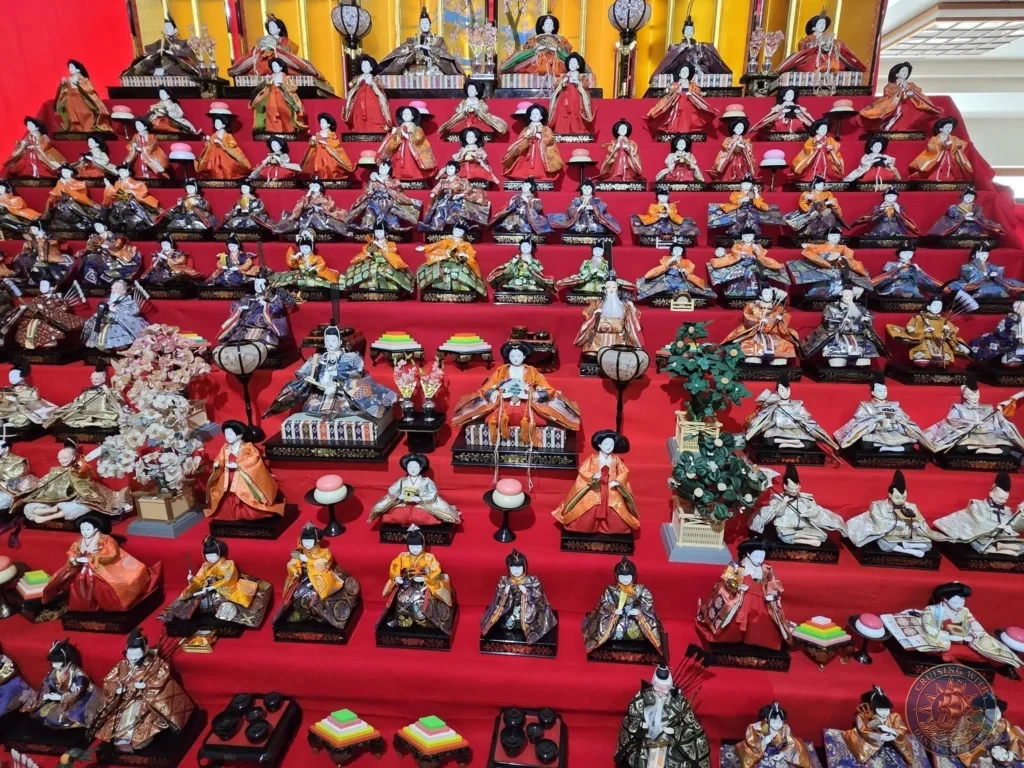 Massive multi-tiered Hina-ningyo doll exhibition with hundreds of traditional Japanese dolls in elaborate kimonos at the Chiran Doll & Toy Museum. Spectacular display in the Chiran Samurai District, Kagoshima, Japan. Kagoshima Cruise Port Guide | Things to do in Kagoshima from cruise ship | One day in Kagoshima Japan itinerary by Danny and Peter.