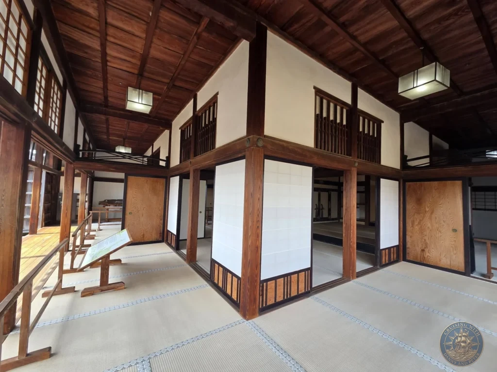 Spacious traditional interior of Kochi Castle featuring tatami mats, wooden beams, and shoji screens in Kochi, Japan. Historic castle architecture. Kochi Cruise Port Guide | Things to do in Kochi from cruise ship | One day in Kochi Japan itinerary by Danny and Peter.