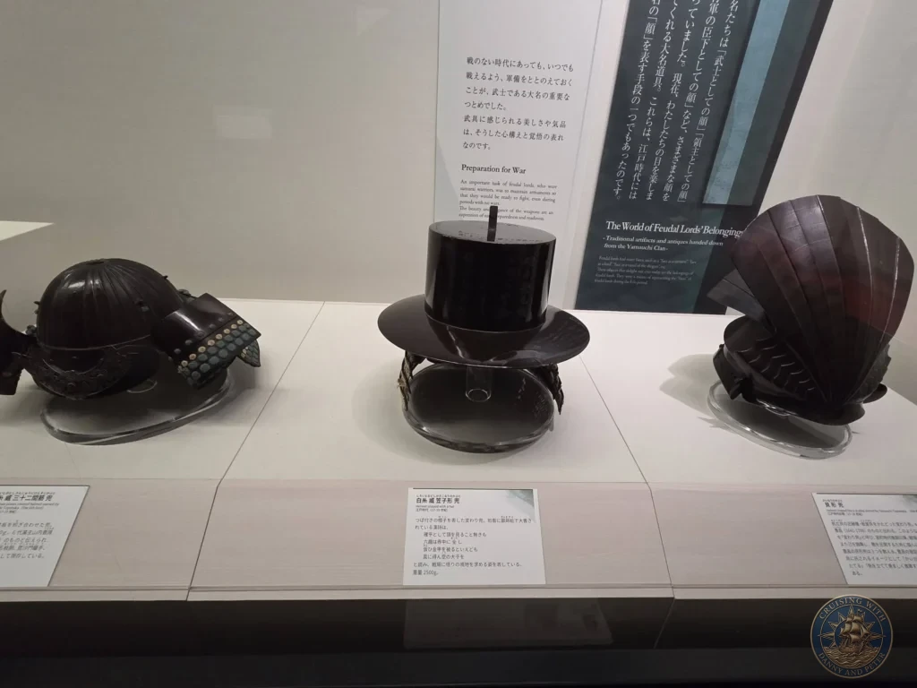 Traditional samurai helmets on display at the Kochi Museum of History in Kochi, Japan. Historic feudal lord artifacts. Kochi Cruise Port Guide | Things to do in Kochi from cruise ship | One day in Kochi Japan itinerary by Danny and Peter.
