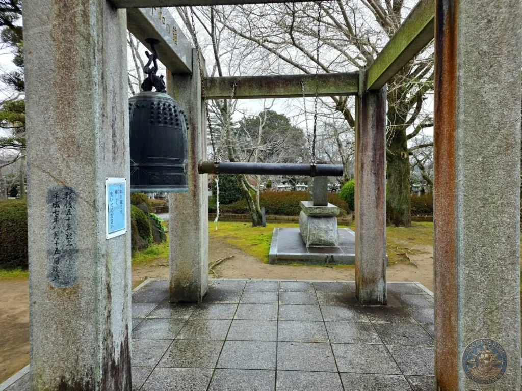 The Peace Bell (平和の鐘) hanging at the Chiran Peace Museum for Kamikaze Pilots. Symbolic memorial bell in the historic grounds dedicated to the Special Attack Forces in Chiran Samurai District, Kagoshima, Japan. Kagoshima Cruise Port Guide | Things to do in Kagoshima from cruise ship | One day in Kagoshima Japan itinerary by Danny and Peter.