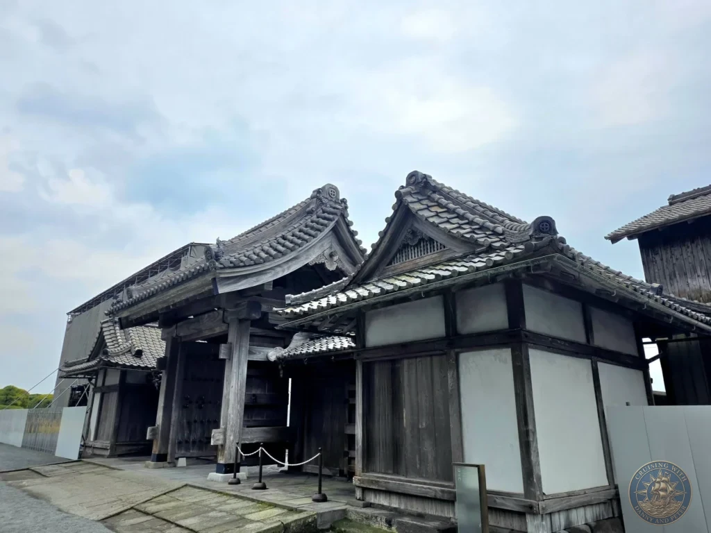 Traditional wooden buildings with classic tiled roofs at Sengan-en (Iso Garden), the historic UNESCO World Heritage samurai villa in Kagoshima, Japan. Stunning preserved Edo-period architecture and garden setting with Sakurajima in the vicinity. Kagoshima Cruise Port Guide | Things to do in Kagoshima from cruise ship | One day in Kagoshima Japan itinerary by Danny and Peter.