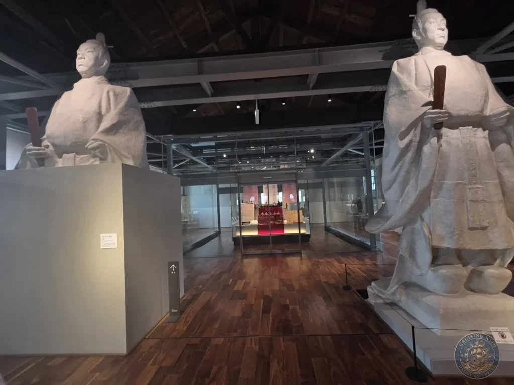 Large white statues of historical figures displayed inside the Shoko Shuseikan UNESCO World Cultural Heritage Museum at Sengan-en (Iso Garden) in Kagoshima, Japan. Exhibits highlighting the Shimazu clan’s contributions to Japan’s modernization. Kagoshima Cruise Port Guide | Things to do in Kagoshima from cruise ship | One day in Kagoshima Japan itinerary by Danny and Peter.