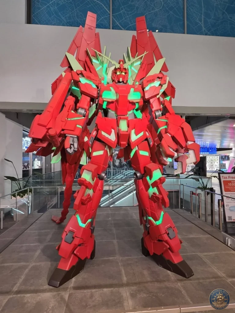 Giant red Gundam statue on display at Canal City Hakata shopping complex in Fukuoka, Japan. Popular attraction. Fukuoka Cruise Port Guide | Things to do in Fukuoka from cruise ship | One day in Fukuoka Japan itinerary by Danny and Peter.