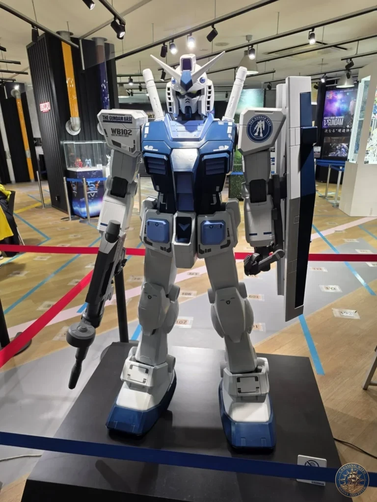Blue and white Gundam statue on display at Canal City Hakata in Fukuoka, Japan. Popular attraction. Fukuoka Cruise Port Guide | Things to do in Fukuoka from cruise ship | One day in Fukuoka Japan itinerary by Danny and Peter.