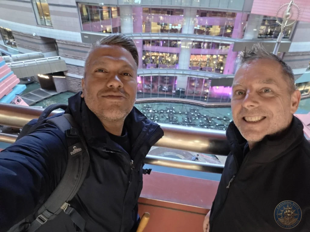 Danny and Peter taking a selfie with the spectacular water fountain show at Canal City Hakata in Fukuoka, Japan. Cruise port highlight. Fukuoka Cruise Port Guide | Things to do in Fukuoka from cruise ship | One day in Fukuoka Japan itinerary by Danny and Peter.