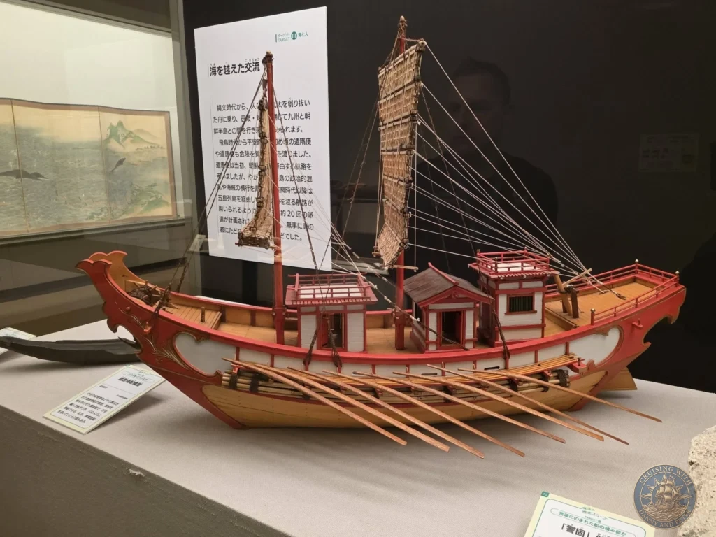 Detailed model of a historical red-hulled Japanese sailing ship at Fukuoka City Museum, Japan. Maritime heritage exhibit. Fukuoka Cruise Port Guide | Things to do in Fukuoka from cruise ship | One day in Fukuoka Japan itinerary by Danny and Peter.