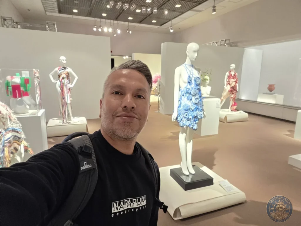 Danny taking a selfie amid contemporary fashion installations at Fukuoka City Museum, Japan. Cruise port cultural visit. Fukuoka Cruise Port Guide | Things to do in Fukuoka from cruise ship | One day in Fukuoka Japan itinerary by Danny and Peter.