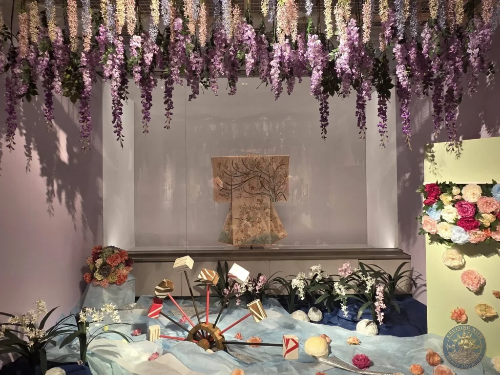 Beautiful hanging wisteria flower installation with kimono display at Fukuoka City Museum, Japan. Artistic exhibit. Fukuoka Cruise Port Guide | Things to do in Fukuoka from cruise ship | One day in Fukuoka Japan itinerary by Danny and Peter.