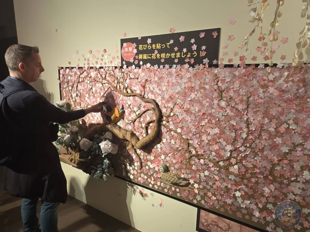 Interactive cherry blossom wall installation with birds at Fukuoka City Museum, Japan. Hands-on exhibit. Fukuoka Cruise Port Guide | Things to do in Fukuoka from cruise ship | One day in Fukuoka Japan itinerary by Danny and Peter.