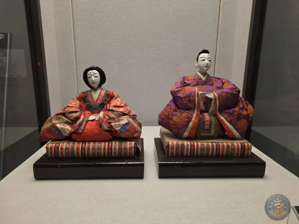 Traditional Hina dolls in elaborate kimonos at Fukuoka City Museum, Japan. Cultural festival artifacts. Fukuoka Cruise Port Guide | Things to do in Fukuoka from cruise ship | One day in Fukuoka Japan itinerary by Danny and Peter.