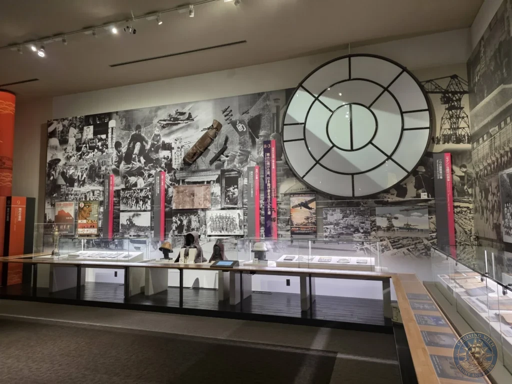 Comprehensive wartime history exhibit with large photo mural, artifacts and displays at Fukuoka City Museum, Japan. Fukuoka Cruise Port Guide | Things to do in Fukuoka from cruise ship | One day in Fukuoka Japan itinerary by Danny and Peter.